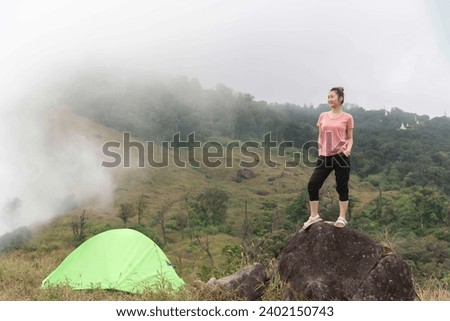 Happy woman tourist to travel in wild trip hiking during vacation.Travel and summer Concept