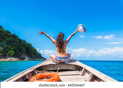 Happy Woman Traveler In Bikini Relaxing On Boat Her Arms Open Feeling Freedom, Andaman Sea, Surin Island, Phangnga,Travel In Thailand, Beautiful Destination Asia, Summer Holiday Outdoors Vacation Trip