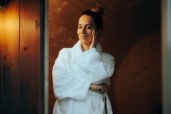 
Happy Woman Trying A Sauna Relaxing On Vacation. Beautiful Girl Enjoying Wellness Therapy In A Hot House 
