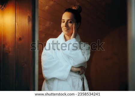 
Happy Woman trying a Sauna Relaxing on Vacation. Beautiful girl enjoying wellness therapy in a hot house 
