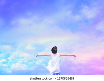 Happy Woman Under Beautiful Blue Sky With Rainbow.