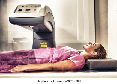 Happy Woman Undergoing Open MRI Scan.