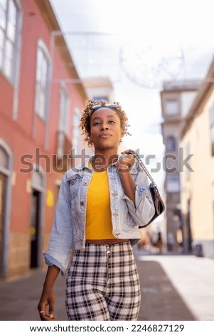 Happy woman walking in the street