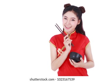 happy woman wearing chinese cheongsam dress with chopsticks and bowl isolated on a white background