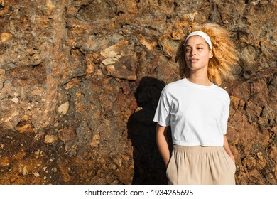 Happy woman in white crop top outdoor photoshoot
