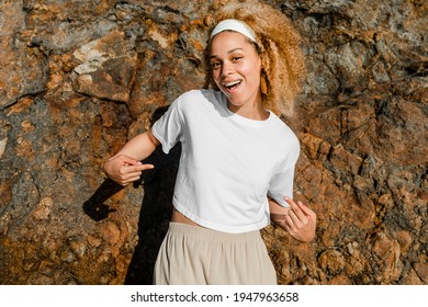 Happy woman in white crop top outdoor photoshoot