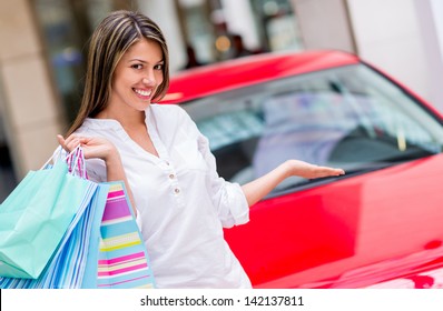 Happy Woman Winning A Car For Shopping At The Mall