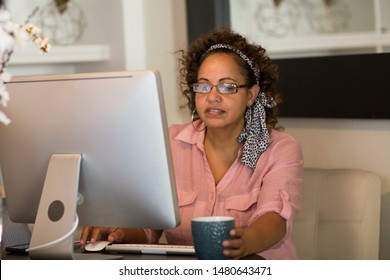 Happy Woman Working From Her Home Office.