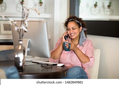 Happy Woman Working From Her Home Office.