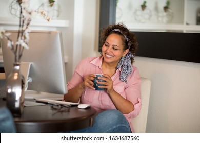 Happy Woman Working From Her Home Office.