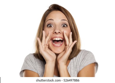 Happy Woman Yelling With Hands Next To The Mouth