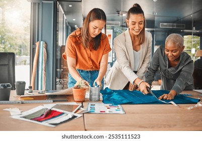 Happy, women and cutting fabric as fashion designer at office with patterns or clothes on project . Startup, employees and creative director with teamwork, collaboration or coworking as stylist - Powered by Shutterstock