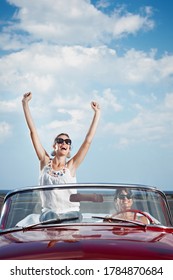 Happy Women Driving Rented Convertible Car For Vacations - Shutterstock ID 1784870684