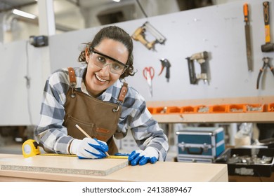 happy women enjoy working designer in wood workshop. Joiner wood apron worker furniture hand crafted factory. - Powered by Shutterstock