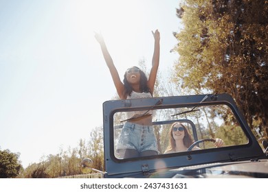 Happy women, excited and travel on road trip in nature and bonding together for adventure on holiday. Friends, driving and journey in convertible van on vacation, countryside and outdoor fun in texas - Powered by Shutterstock
