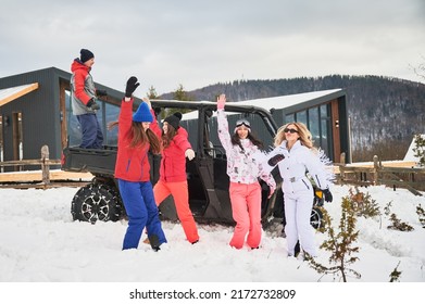 Happy Women Having Fun In Snow. Off-road Buggy Car On Background. Concept Of Active Leisure And Winter Activities.