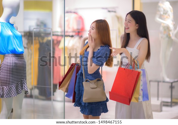 happy women and joyful and exciting in\
shopping mall center, buying and shopping consumerism, discount and\
sale period for customer\
shopping\
