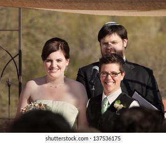 Happy Women With Rabbi In Civil Union Ceremony