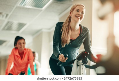 Happy, women and spinning class for fitness, health and training advice in gym studio. Excited, female people and cycling instructor for workout motivation, exercise support and collaboration - Powered by Shutterstock