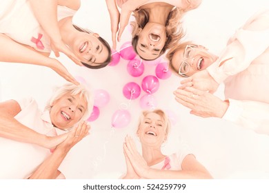 Happy Women Standing Together In Fight Against Cancer, Bottom-up View