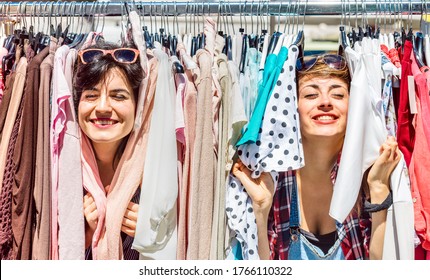 Happy Women At Weekly Flea Market - Female Friends Having Fun Together Shopping Cloth On Sunny Day - Millenial Lifestyle Concept With Girlfriends Enjoying Everyday Life Moments - Bright Vivid Filter