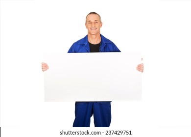 Happy worker presenting empty banner.