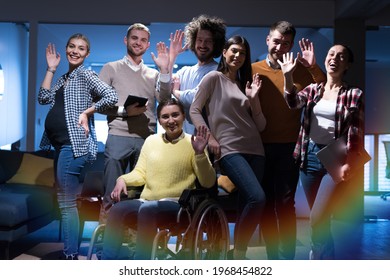 Happy Workers Have Fun  in Modern Office, Handicaped Man on Wheelchair.  Communication with Colleagues. Teamwork and disability Concept