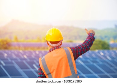 Happy Working At Solar Power Station, Electrician Is Repairing, Engineer Team With Solar Panel, Concept Of Sustainable Resources.