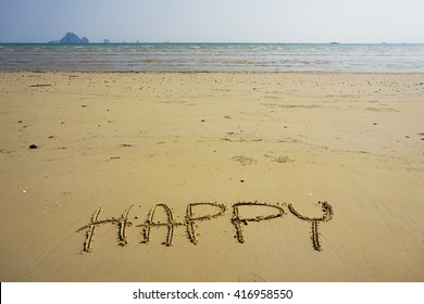 Happy write on sand at beach, front view.