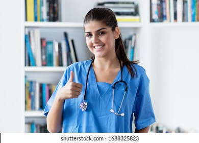 Happy Young Adult Spanish Female Nurse Or Medical Student At Hospital
