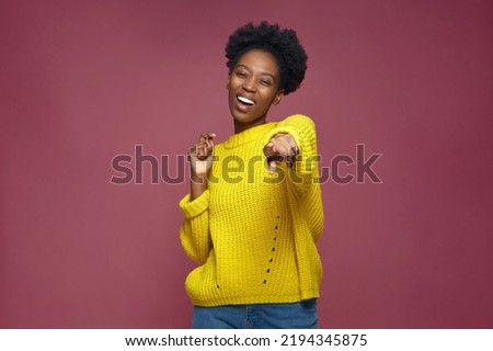 Happy young african american girl pointing to camera, laughing at joke, having fun. Humor, positive emotion concept