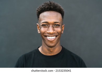 Happy Young African Teenager Smiling In Front Of Camera