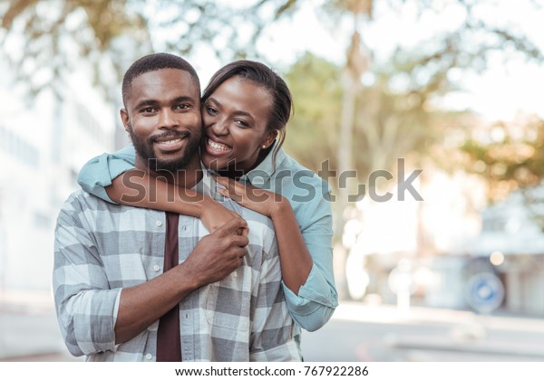 Happy Young African Woman Hugging Her Stock Photo 767922286 | Shutterstock