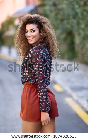 Similar – Beautiful young arabic woman with black curly hairstyle