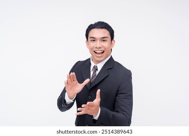 A happy young asian business executive applauding someone's efforts, clapping with his hands. Giving rousing encouragement. Isolated on a white background. - Powered by Shutterstock