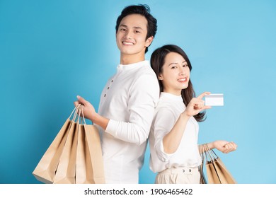 Happy Young Asian Couple Happily Going Shopping