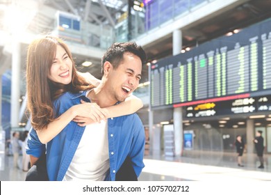 Happy Young Asian Couple Tourist Having Fun, Enjoy At Airport Terminal. Lover Student Smile With Summer Travel In Vacation Holiday. Honeymoon Trip Concept.