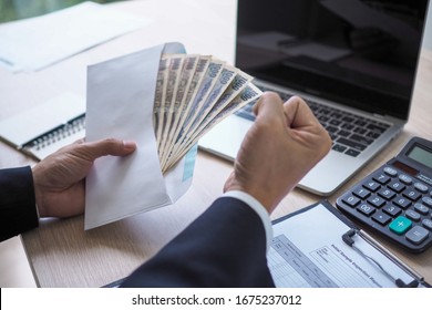 Happy Young Asian Employee Business Man Holding Money Bonus Card In Paper Envelope To Increasing Of Salary Or Promotion New Position In Office, Bonus