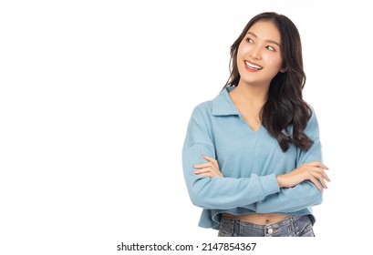 Happy Young Asian Girl Hold Hands Crossed Toothy Smiling Pretty Young Woman Get Happy And Friendly Smiling Beautiful Woman Looking Up And Imaginary To Copy Space With Crossed Arm Isolated On White