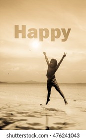 Happy Young Asian Girl Jumping On The Beautiful White Beach Of Thailand