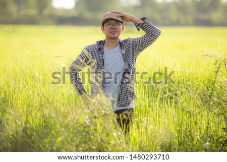 Similar – young man with hat in front of mountain panorama