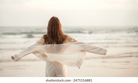 Happy young asian woman with freedom on the sea beach at golden sunset, Summer beach vacation concept. - Powered by Shutterstock