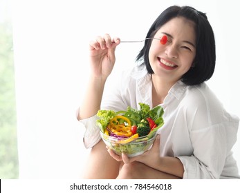 'Happy Young Asian Woman With Fresh Vegetable And Fresh Fruit,healthy Concept.