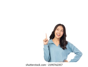 Happy young Asian woman looking above and pointing up to copy space with smile face and happy Pretty girl act like a satisfied product, use for advertising with isolated on white background - Shutterstock ID 2190762357