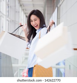 Happy Young Asian Woman Shopping.