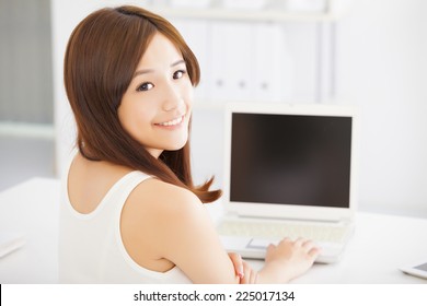 Happy Young Asian Woman Using A Laptop