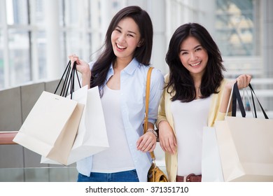 Happy Young Asian Women Shopping.