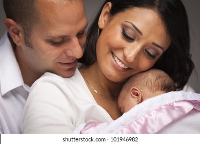 Happy Young Attractive Mixed Race Family With Newborn Baby.