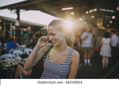 Happy Young Backpacker Is Exploring Queen Victoria Market In Australia