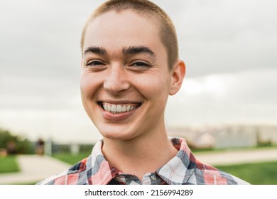 Happy Young Bald Woman Looking At Camera Outdoor - Authentic And Real People Concept